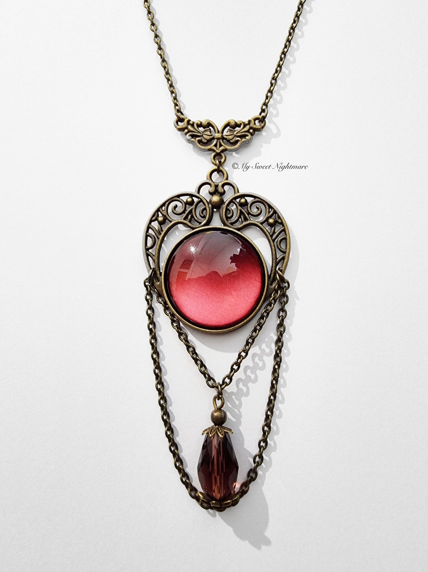 Collana vittoriana in bronzo con pietra rossa in vetro e cristallo