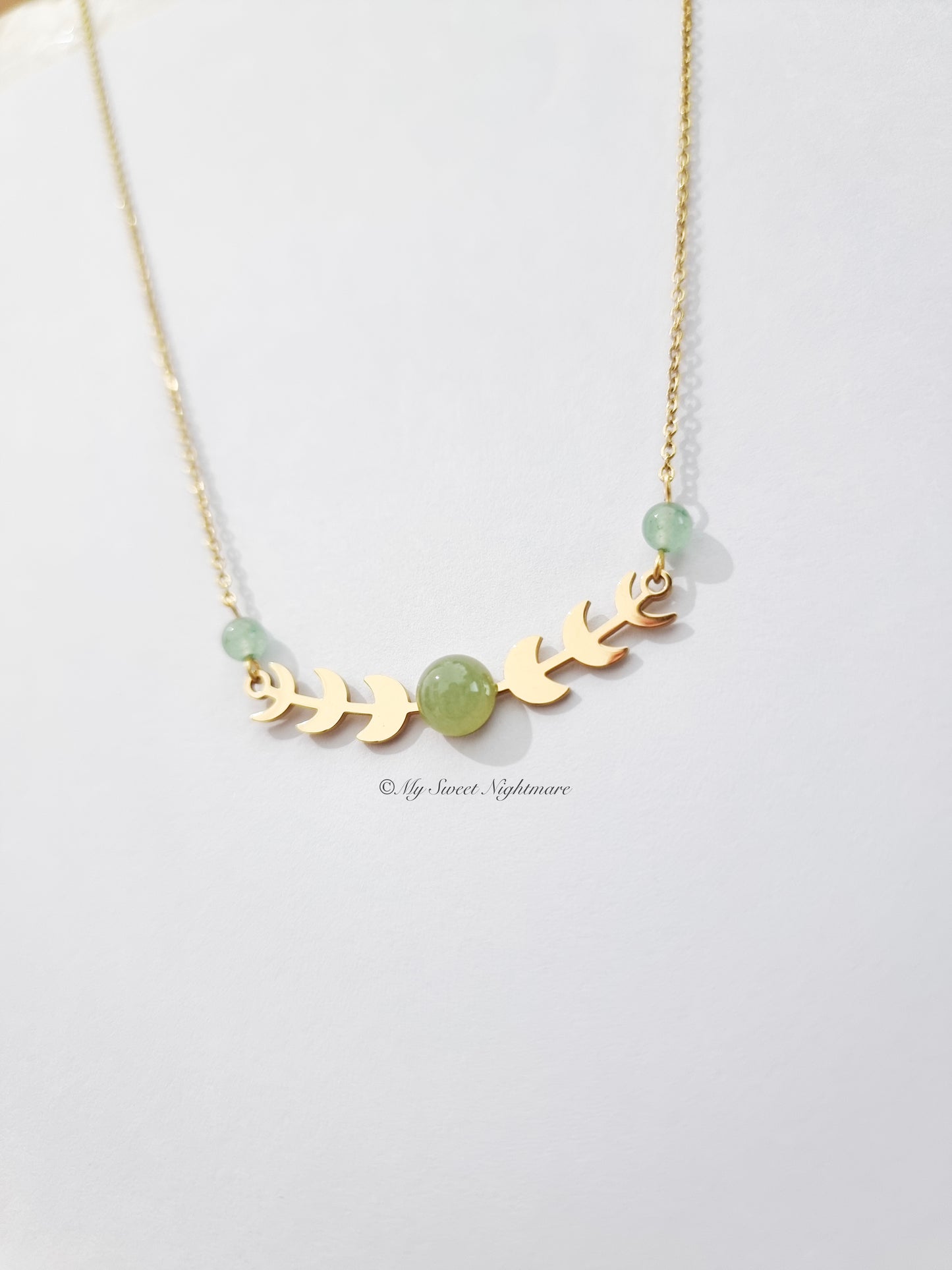 Moon phases in gold steel with green aventurine