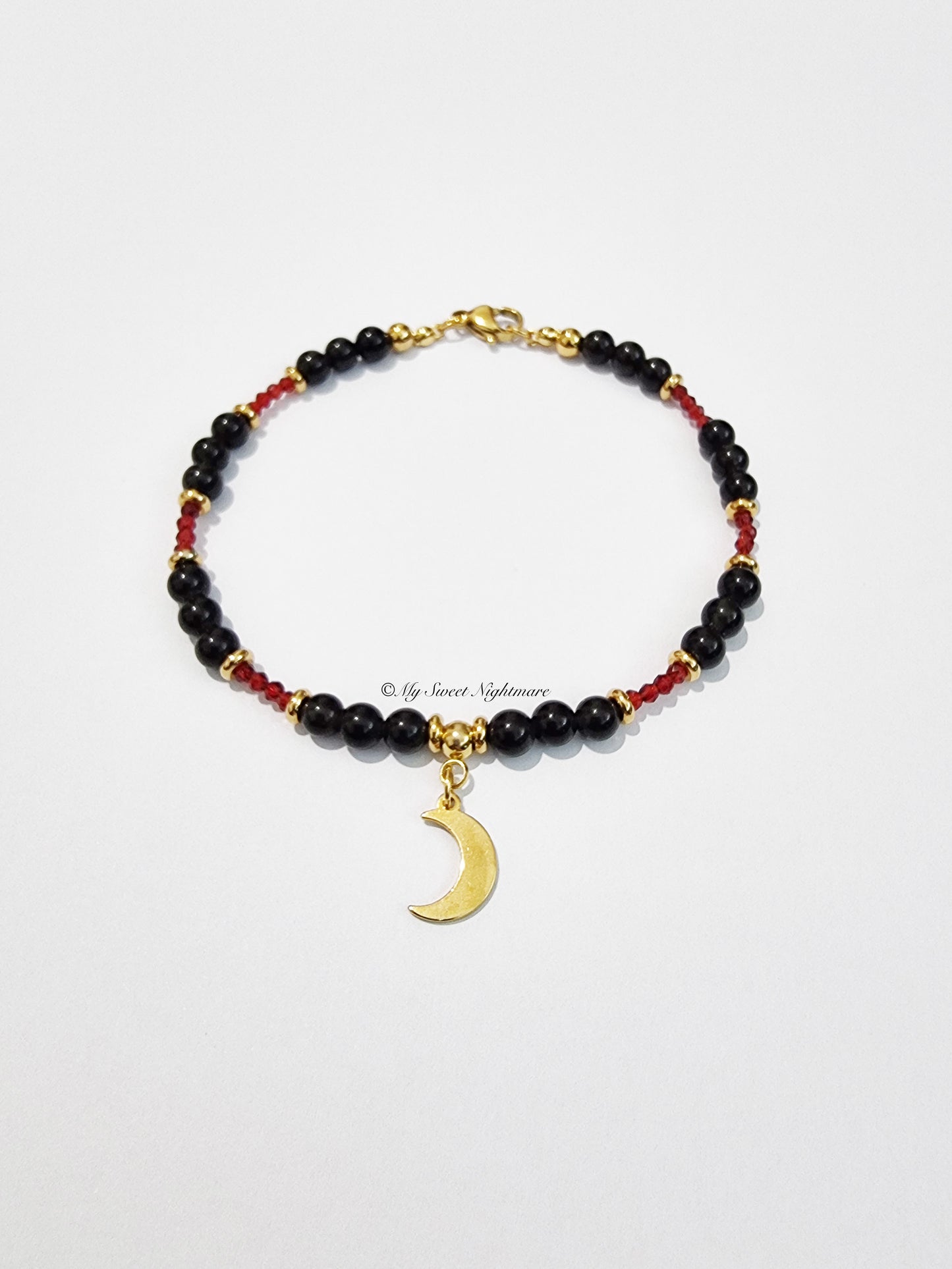 Bracelet with Golden Obsidian, crescent moon and red crystals