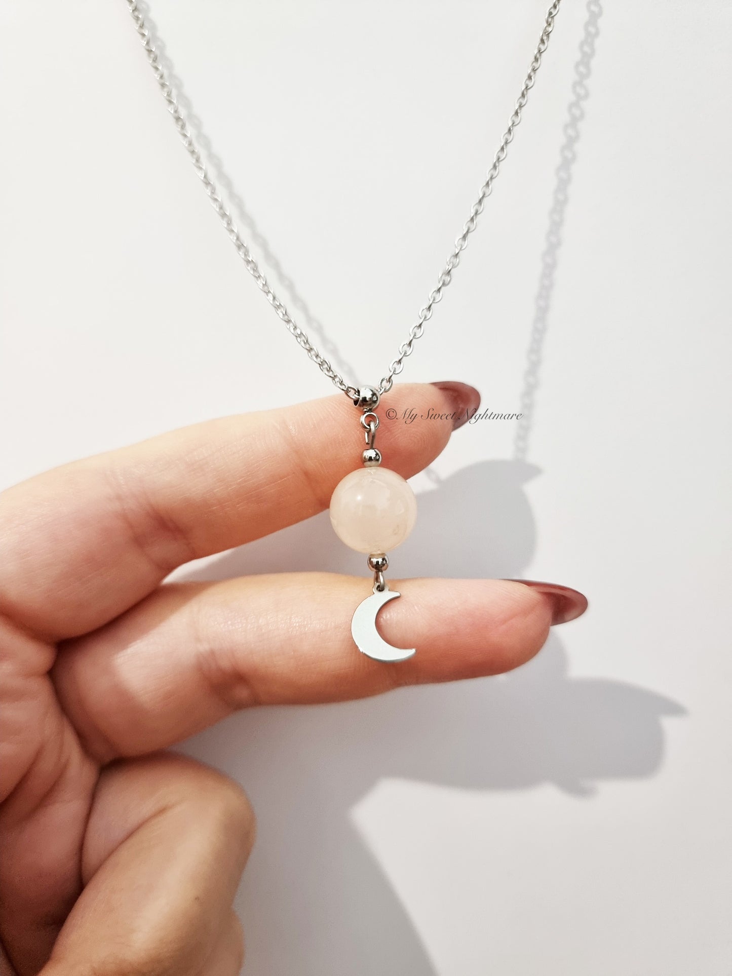 Collana con luna crescente e quarzo rosa